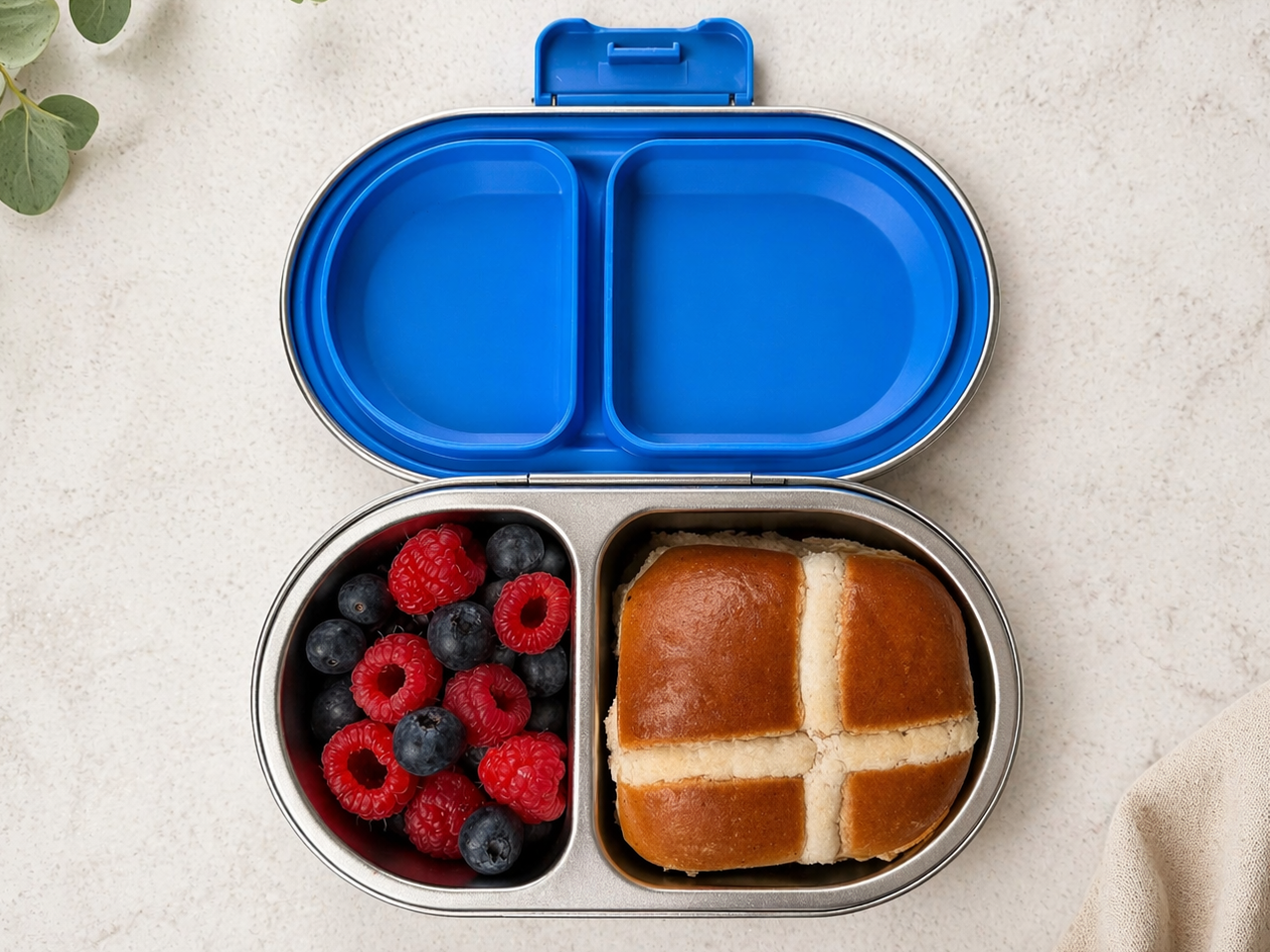 Stainless steel bento go snackbox from Oli Eve with real food in it